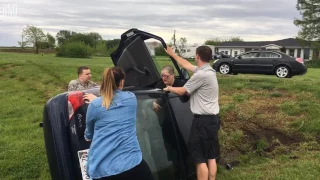 Woman gets out of overturned vehicle