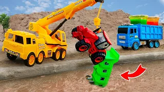 Rescue the mini tractor,  truck from the pit with excavator and crane truck