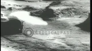 A US Army jeep turns over during testing in the Pacific Theater of War during Wor...HD Stock Footage