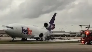 FedEx plane bursts into flames on runway
