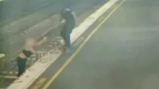 Narrow escape for woman walking on train tracks in Melbourne