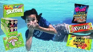 Trying SOUR CANDY underwater!!