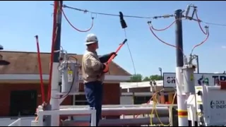 Pinhole in glove on power line