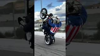 Twin cam softail night train wheelie.           Performed by a professional in a closed lot. ￼