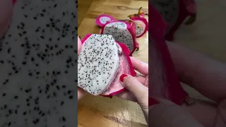 Cutting open a dragon fruit