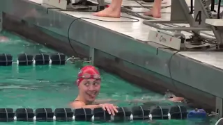 Mimi Watts wins the 100 butterfly at the 2023 Patriot League Swim & Dive Championships