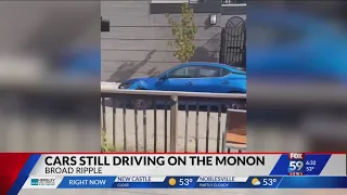 Cars still driving on Monon Trail