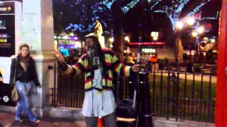 Rastaman street artist performs ''No woman no cry'' in London