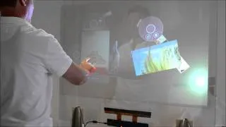 Transform glass in a multi-touch experience using a rear projection holographic film