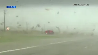 Driver keeps truckin' after tornado flips his pickup