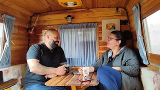 WE ARE CHATTING IN THE CARAVAN IN THE RAIN