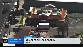 Armored truck guard robbed at gunpoint outside of Taco Bell in Reseda