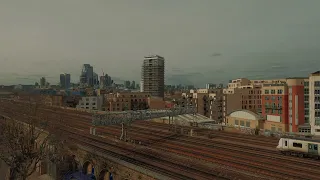 4K Video London, UK. City and Trains View on Railroads From Balcony