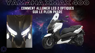 YAMAHA XMAX 400  Allumer les 2 phares en même temps en position plein phare.