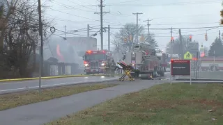 Columbus Fire works to put out two-alarm blaze on Kinnear Road after vehicle crashes into house