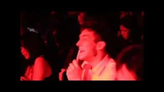 guy brushes teeth at a weezbow concert