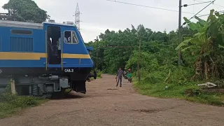 Goods train crossing unmanned level crossing & stops