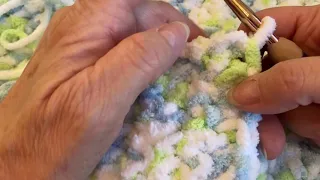 Bernat baby blanket yarn, this pattern is great for beginners! A single crochet stitch.