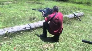 M249 with blown (baffle strike) AAC suppressor