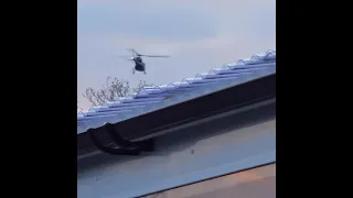 low flying helicopter circling