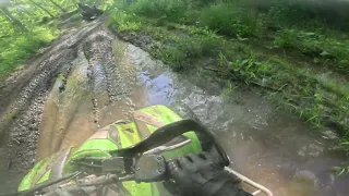 Riding a 2005 KFX400 with my mom in the trails and gits stuck in mud