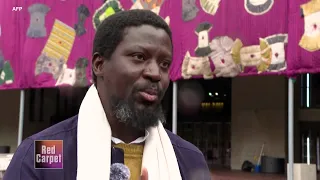 Ghanaian artist's purple artwork covers London's iconic Barbican