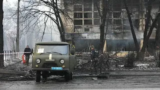 Ukraine soldiers remove bodies after Russian strikes on Kyiv TV tower