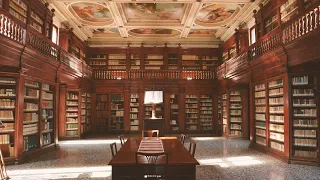 sit in a medieval library while classical music plays