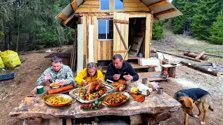 In Log Cabin in the Forest. Outdoor Cooking, Campfire Food, Earth Oven, Cauldron Food in  Wilderness