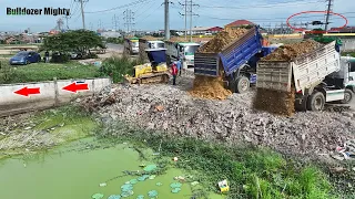 Nice Showing Action Filling Up The Land huge, Bulldozer Push Soil & Stone Into Water, Dump Truck