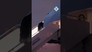 Moment US President Joe Biden trips up Air Force One stairs before leaving Poland