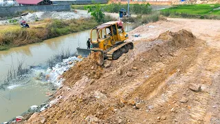 The New Project And Good Work Dozer KOMATSU Push Land In Water And Clearing land