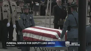 American flag folded, presented to Deputy Luke Gross' family during his funeral service