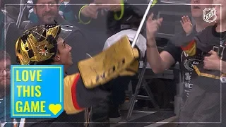 Marc-Andre Fleury hands stick over the glass to young fan