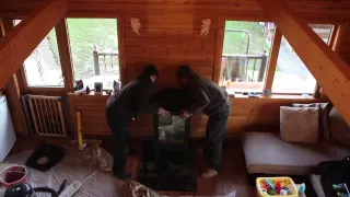 Wood stove installation in a log cabin