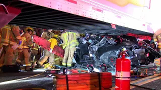 Four Trapped in Dodge Charger Wedged Under Semi-trailer