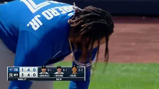 Vladimir Guerrero Jr. breaks his bat over his knee after strikeout