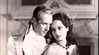 Leslie Howard and Merle Oberon in "A Minuet"