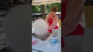 A pretty girl making cotton candy #shorts #worldbestplaces #travel #cottoncandy #latvia #riga