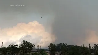 Helicopters battle wildfire on Hawaii's Oahu Island