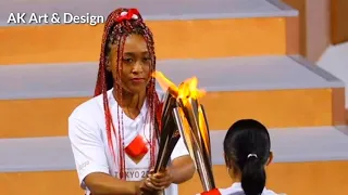 Naomi Osaka light olympic cauldron - naomi osaka lights the torch.naomi osaka lights