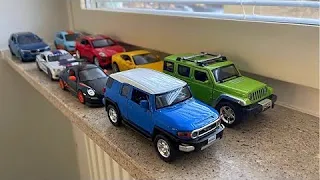 Big Sized Diecast Model Cars Driven By Hand On Windowsill