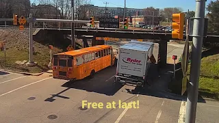 Boxtruck wrestles with 11foot8 bridge while train crosses
