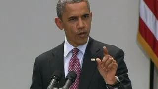 Barack Obama heckled during immigration press conference