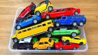 Huge Box Full of Diecast Cars Each of Them Being Reviewed in Hands
