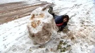 Watch reporter go face-first into giant snowman