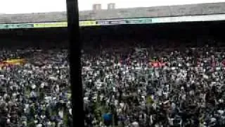 Leeds United Fans on the pitch singing after promotion to the championship!