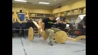 Riding a bike made of wood