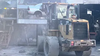 Junkyard car crushing. Very satisfying