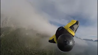 Wingsuit flying over clouds - Wingsuit BASE jumping in the Alps